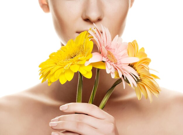 Young woman with gerber flower