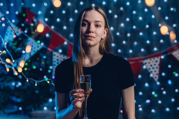 Young woman with a glass of champagne.