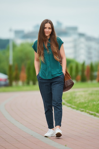 Young woman with a green shirt in the park