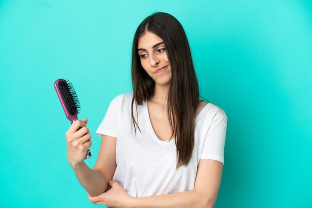 Young woman with hair comb