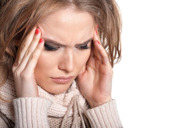 Young woman with headache isolated on white background