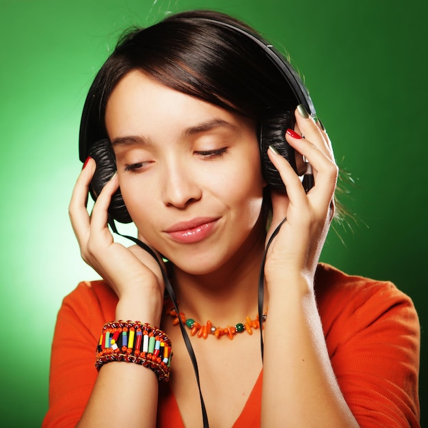 Young woman with headphones listening music