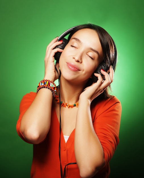 Young  woman with headphones listening to music