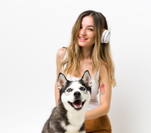 Young woman with her husky dog