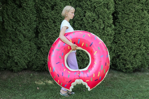 Young woman with an inflatable circle with a dout