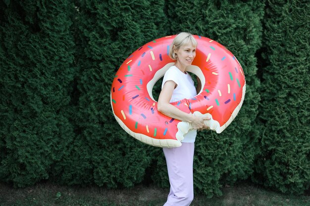 Young woman with an inflatable circle with a dout