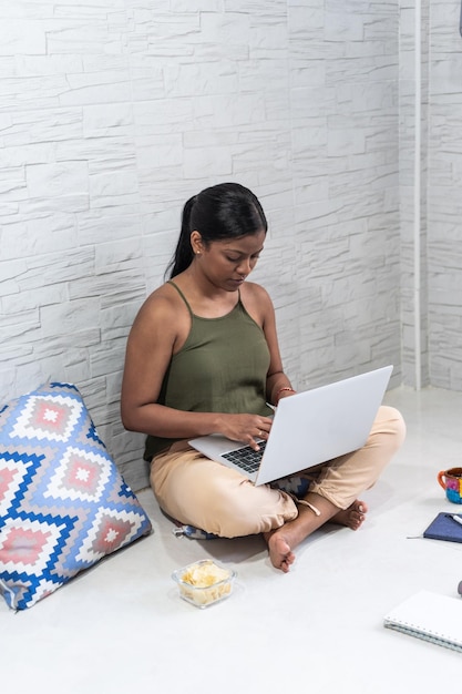 Young Woman With Laptop Working At Home