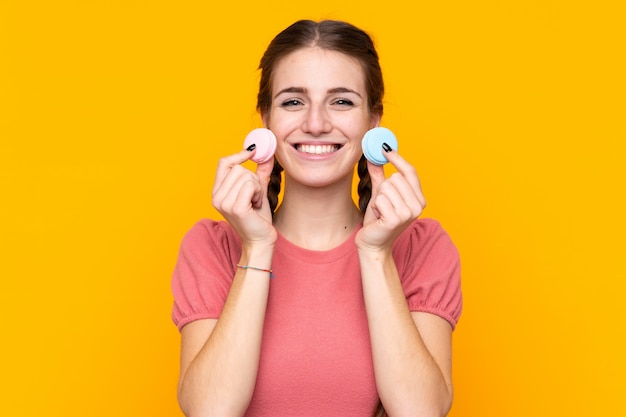 Young woman with macarons