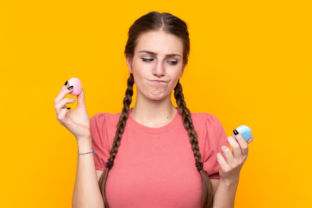 Young woman with macarons