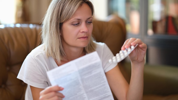 Young woman with medicines and pills closeup