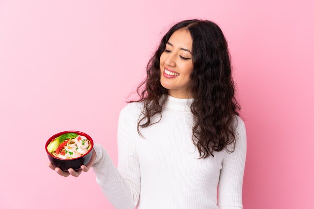 Young woman with noodles