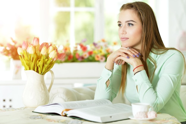 Young woman with opened book