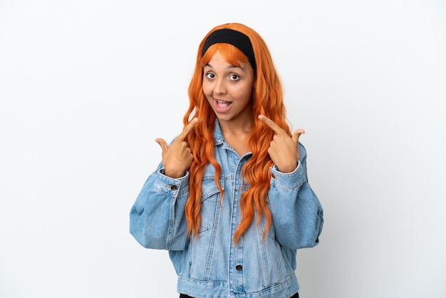 Young woman with orange hair isolated on white background giving a thumbs up gesture