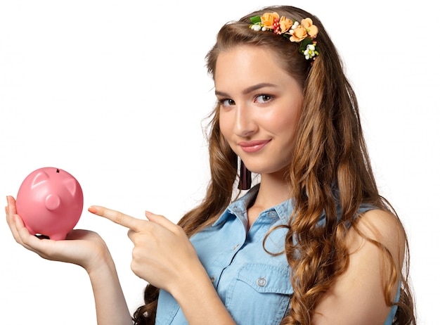 Young woman with piggy bank