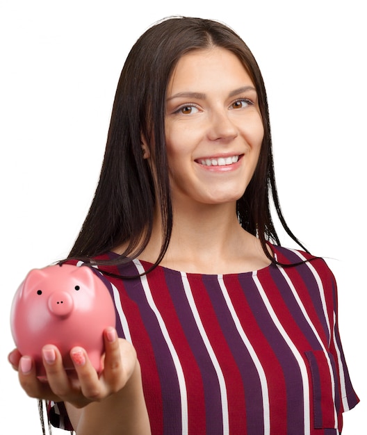 Young woman with piggy bank