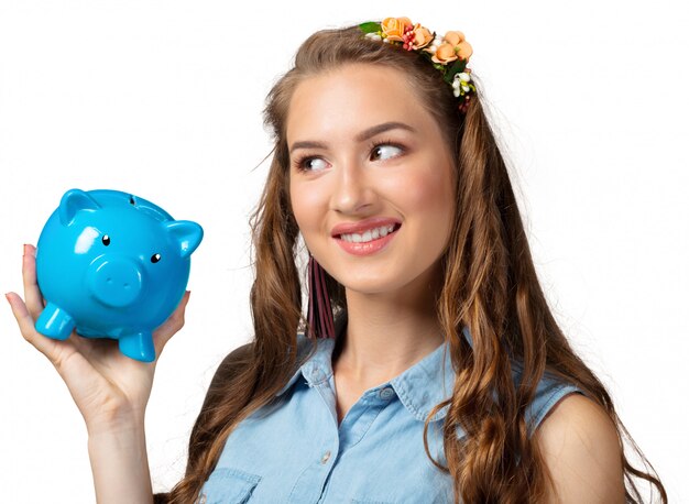 Young woman with piggy bank