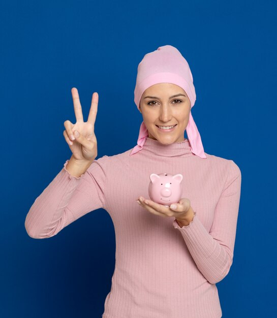 Young woman with pink scarf on the head