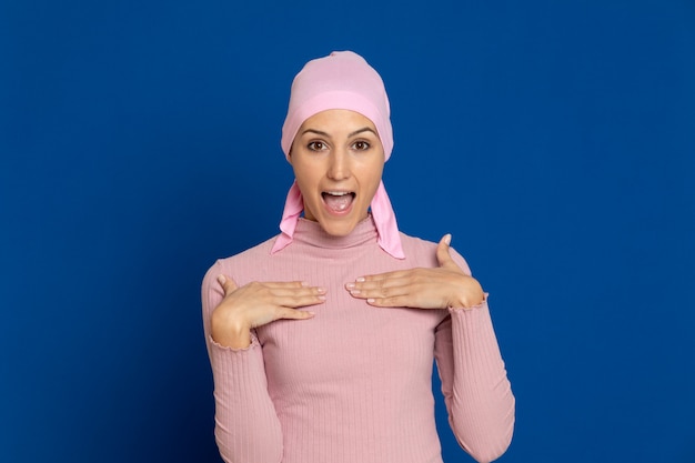 Young woman with pink scarf on the head