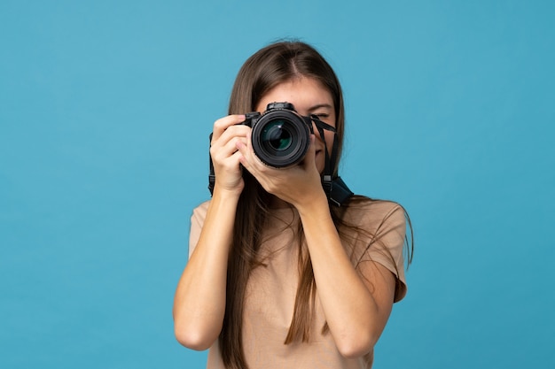 Young woman with a professional camera