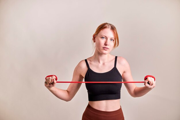 Young woman with red hair training