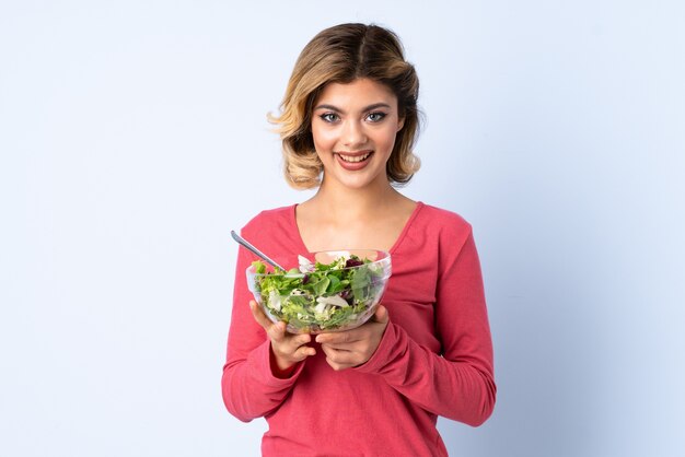 Young woman with a salad bowl