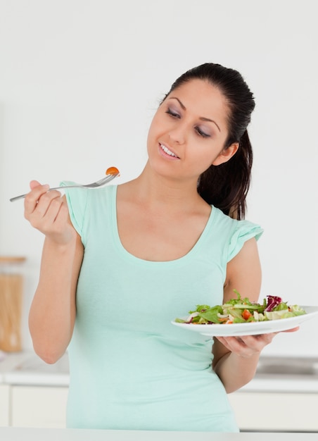 A young woman with salad