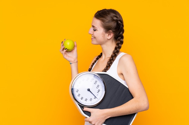 Young woman with a scale