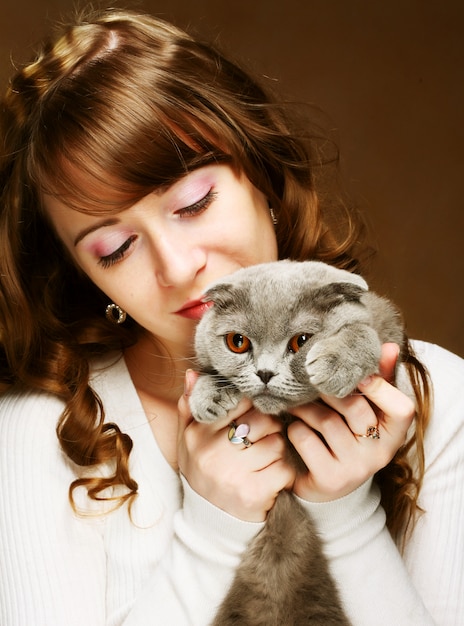 Young woman with scottishcat