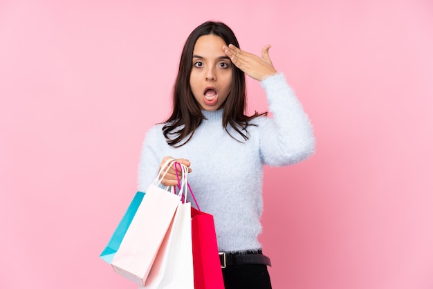 Young woman with shopping bag has just realized something and has intending the solution
