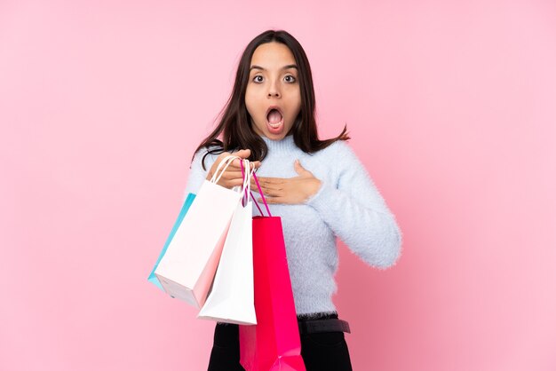 Young woman with shopping bag isolated