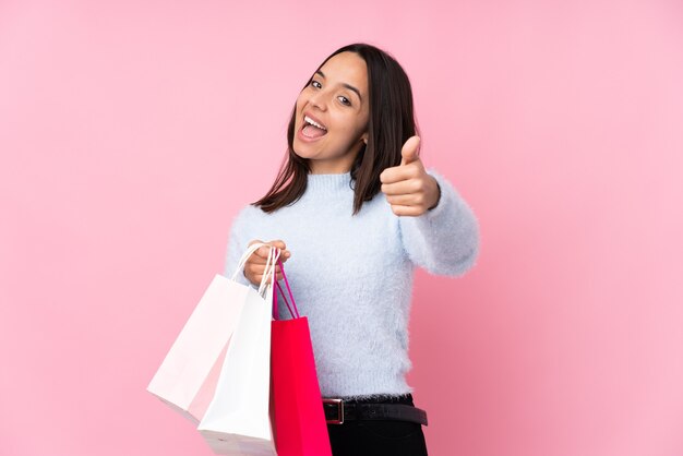 Young woman with shopping bag isolated