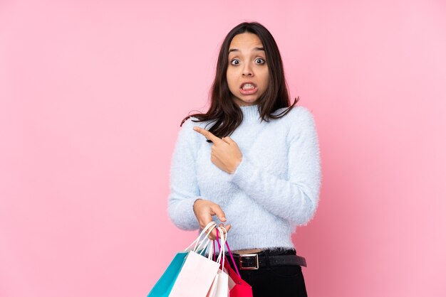 Young woman with shopping bag isolated