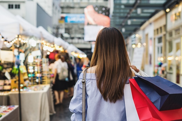 Young woman with shopping bags in the shop