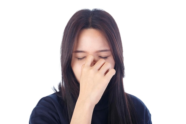 Young woman with sinus pressure pain isolated on white background