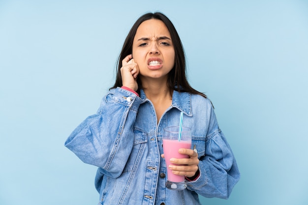 Young woman with strawberry milkshake isolated