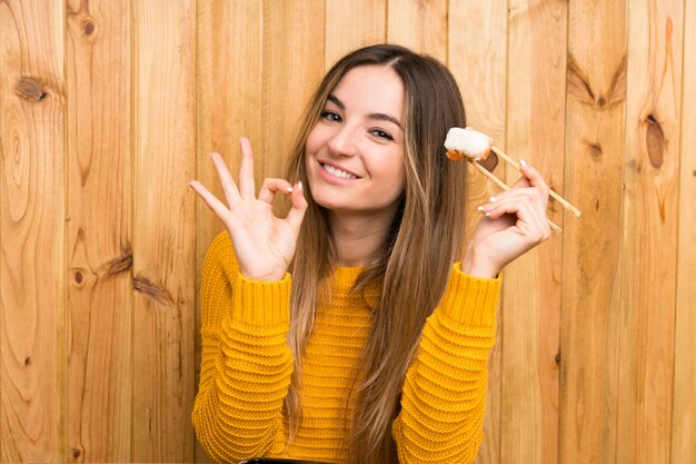 Young woman with sushi