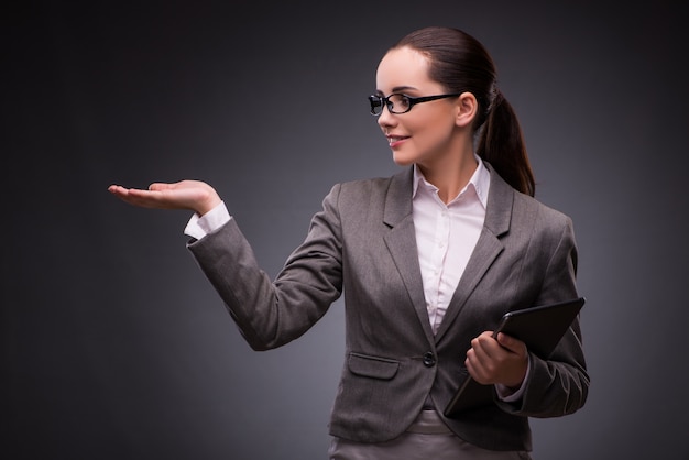 Young woman with tablet in business 