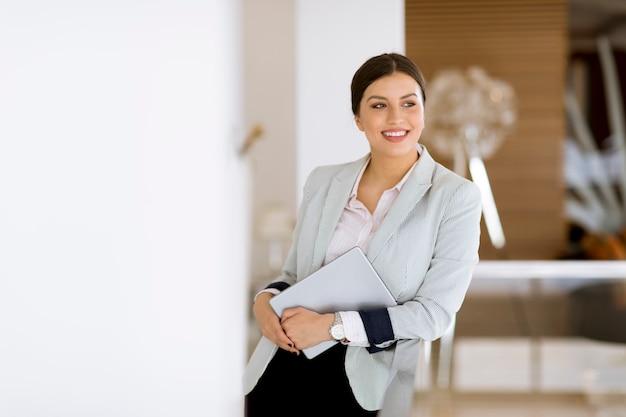 Young woman with a tablet in the office