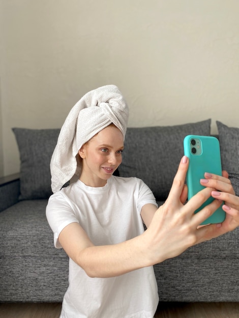 Young woman with a towel on her head