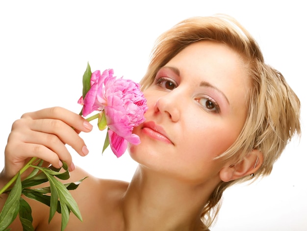 Young woman with treepeony flower