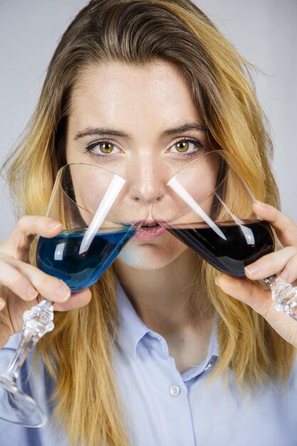 Young woman with two glasses of wine