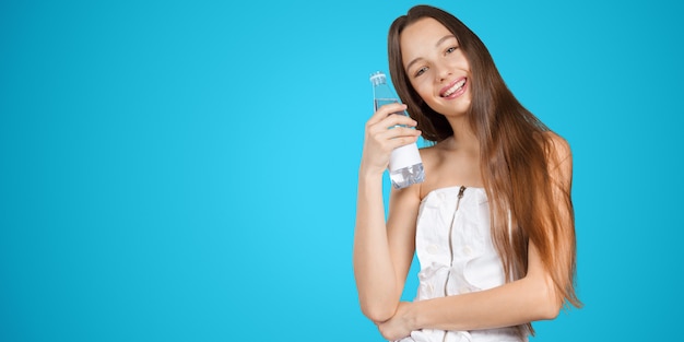 Young woman with a water bottle drinking water