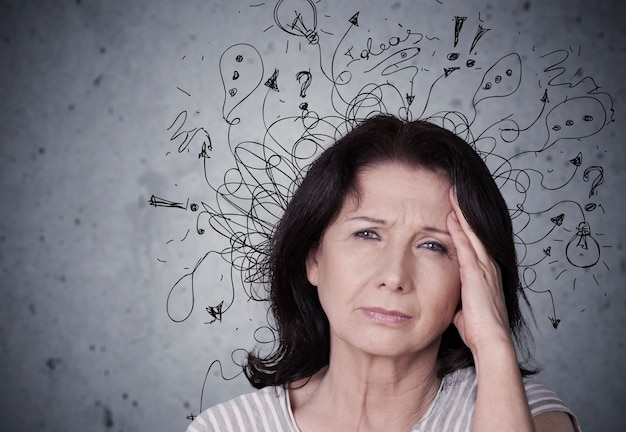 Young woman with worried stressed face expression with illustration