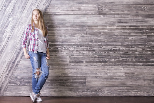 Young woman on wooden background