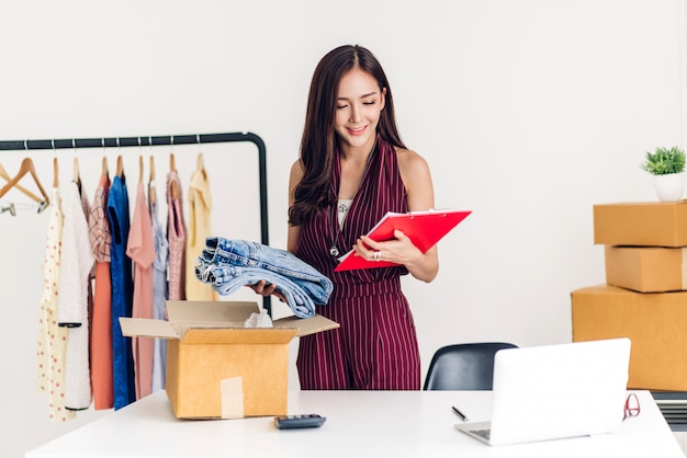 Young woman working in a clothes shop