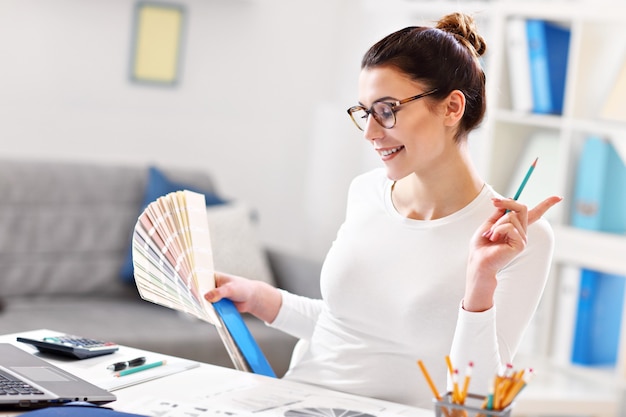 young woman working in her home office