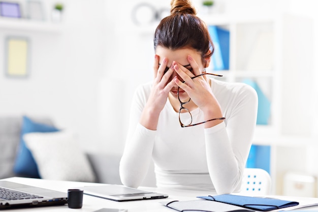 young woman working in her home office