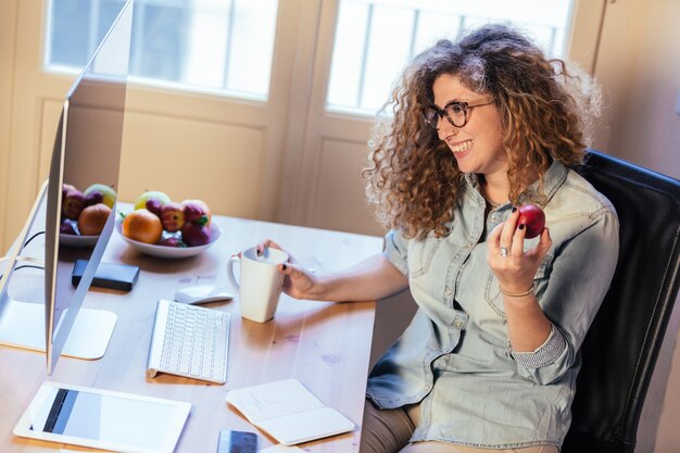 Young woman working at home or in a small office