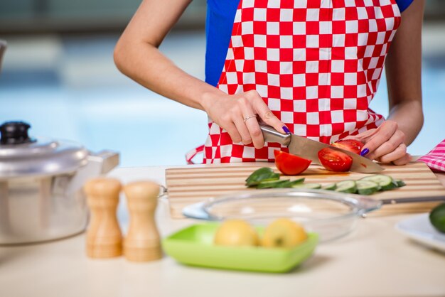 Young woman working in the kitchen