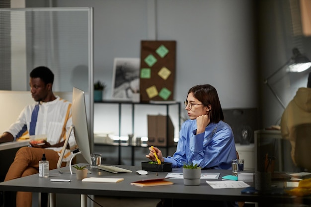 Young Woman Working Late in Evening